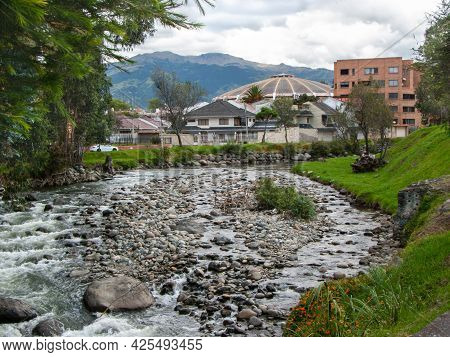 View At The Park Area And Tomebamba River Which Crosses Residential District In Cuenca City, Ecuador