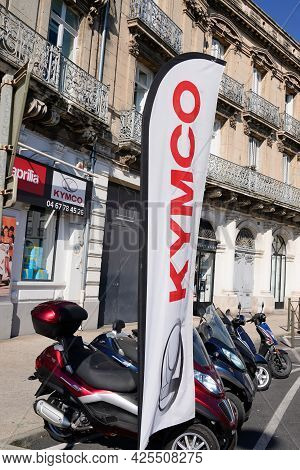 Sète , Ocitanie France  - 06 30 2021 : Kymco Brand Text On Flag Street Front Of Store Scooter Dealer