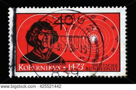 ZAGREB, CROATIA - AUGUST 28, 2014: A stamp printed in Germany showing astronomer and mathematician Nicolaus Copernicus and his solar system, 500th Birth Anniversary of Copernicus, circa 1973.