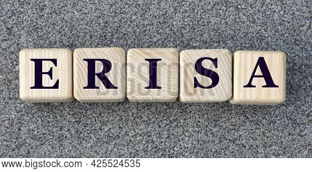 Erisa (employee Retirement Income Security Act) - Acronym On Wooden Cubes On A Gray Background. Busi