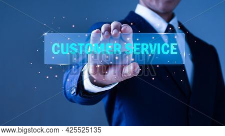 A Businessman Holds Out His Hand To Hold A Glowing Sign With Customer Service Letters.