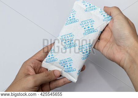 Desiccant Silica On The Pack. Closeup View. Packet Of Silica Gel Buried In Silica Crystals