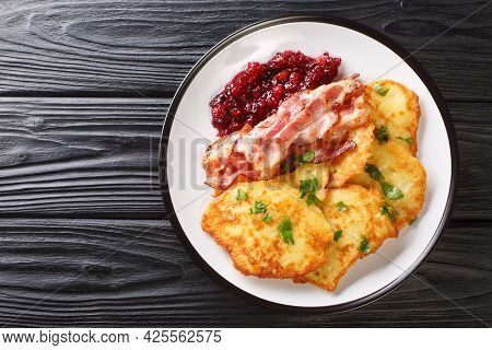 Swedish Potato Pancakes With Fried Pork Raggmunk Med Flask Close-up In A Plate On The Table. Horizon