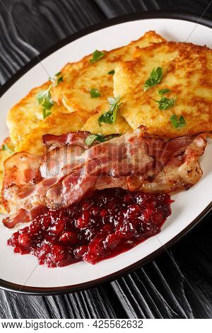 Raggmunk Crispy Swedish Potato Pancake With Lingonberry Jam And Bacon Close-up In A Plate On The Tab