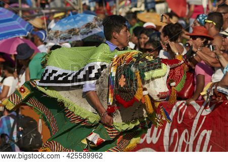 Arica, Chile - January 23, 2016: Members Of A Waca Waca Dance Group In Ornate Costume Performing At 
