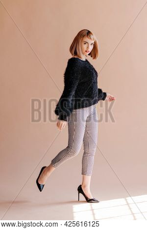 Woman in a fluffy sweater posing