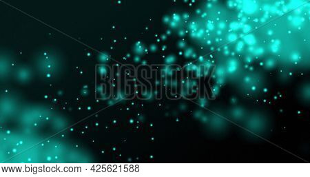 Glowing blue particles floating upwards on a dark background. light, colour, energy and movement concept, digitally generated image.