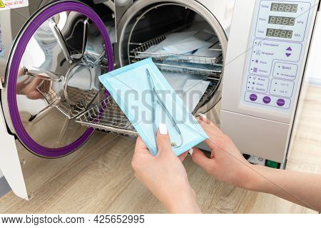 Sterilizing Medical Instruments In Autoclave In Madical Clinic