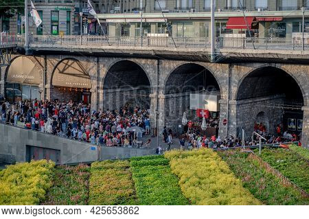 Lausanne, Canton Of Vaud, Switzerland - July 2 2021: Crowd Of People Watching Uefa Euro 2020 Footbal