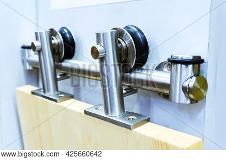 Roller Door. Stainless Steel Sliding Door Mechanism With Guide Bar. Close-up