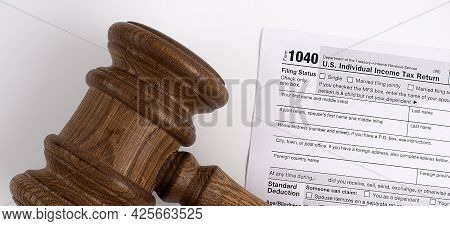 Judge's Gavel Over 1040 Us Tax Form. Business