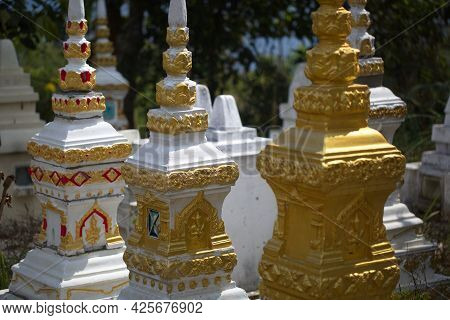 Traditional Asian Golden Statutes In Buddhist Monastery Phongsali, Laos.