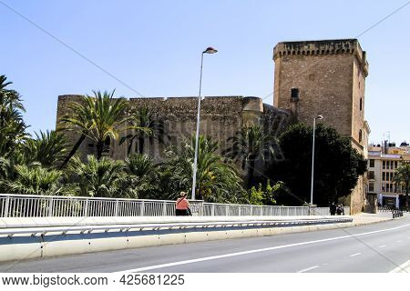 Elche, Alicante, Spain- July 2, 2021: Beautiful Altamira Palace And Altamira Bridge Next To Lush Lan