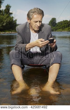 Manager In Grey Suit Became Crazy Of Hot Weather And Cooling In River