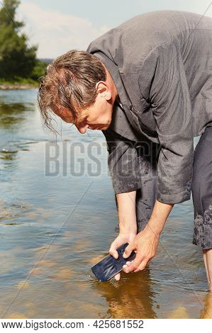 Manager In Grey Suit Became Crazy Of Hot Weather And Cooling In River