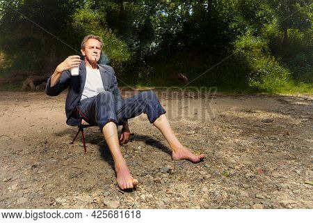 Manager In Grey Suit Became Crazy Of Hot Weather And Cooling On River Bank