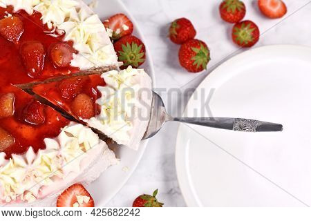 Slice Of Strawberry Fruit Cream Cake On Cake Server