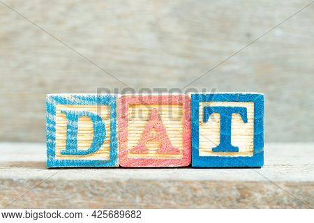 Color Alphabet Letter Block In Word Dat (abbreviation Of Delivery At Terminal) On Wood Background