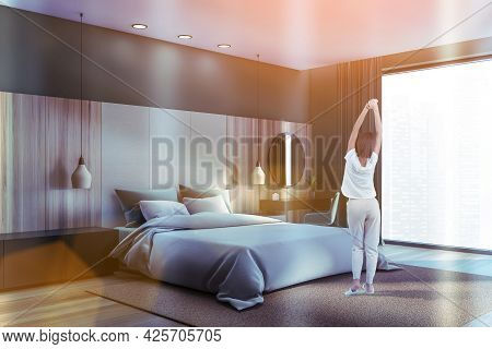 Luxury Bedroom At Modern Contemporary Skyscraper Apartment In Financial Downtown. Woman In Cozy Home