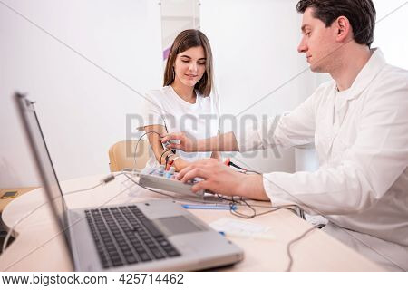 Patient Nerves Testing Using Electromyography At Medical Center