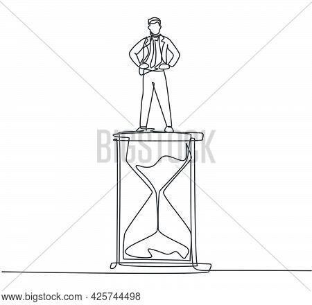 Continuous One Line Drawing Young Male Worker Standing Above Hourglass. Sandglass To Show Time Manag