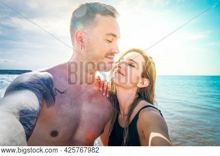 Happy Young Couple At The Sea Vacations Doing Selfie, Summer Vacations And Relaxation, Toned