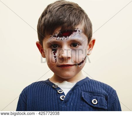 Little Cute Child With Facepaint On Birthday Party, Zombie Apocalypse Facepainting, Halloween Prepar