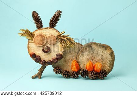Seasonal Autumn Craft With Kids. Children's Cute Worm Or Caterpillar Made Of Natural Materials - Con