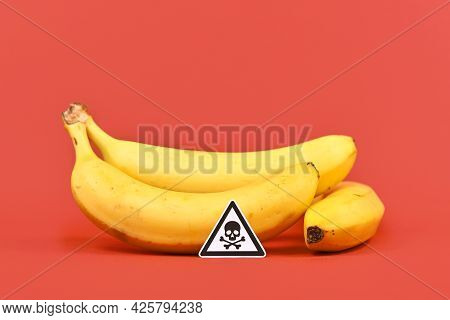 Concept For Unhealthy Or Toxic Substances In Food Like Pesticide Residues With Skull Warning Sign In