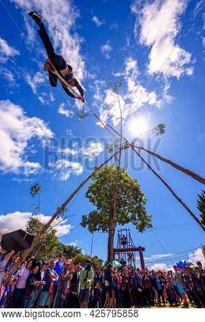 Akha Tribe Playing With The Wooden Swing On Akha Swing Festival At Doi Mae Salong. The Annual Akha S