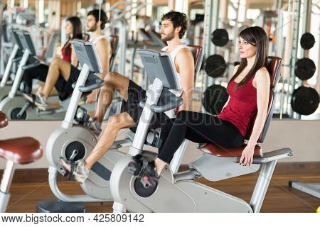 Group of people working out on a stationary bike