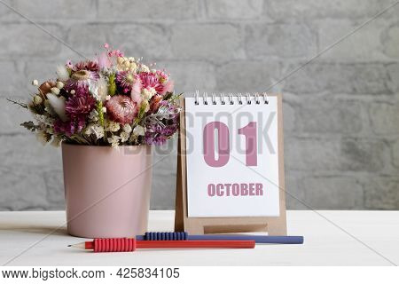 October 01. 01-th Day Of The Month, Calendar Date.a Delicate Bouquet Of Flowers In A Pink Vase, Two 