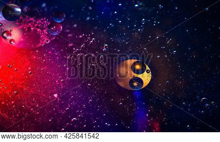 Close-up Of The Interaction Of Water, Oil And Light To Create A Ufo