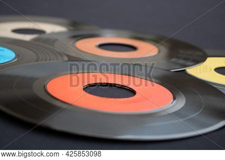 Macro Photography Of 7 Inch Single Vinyl Records On A Dark Background With Selective Focus. Backgrou