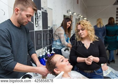 Keune Brand Technologist Artem Raychuk Dyes The Hair Of A Model On Advertising Workshop