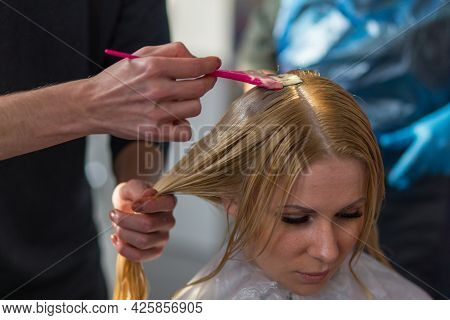 Keune Brand Technologist Artem Raychuk Dyes The Hair Of A Model On Advertising Workshop