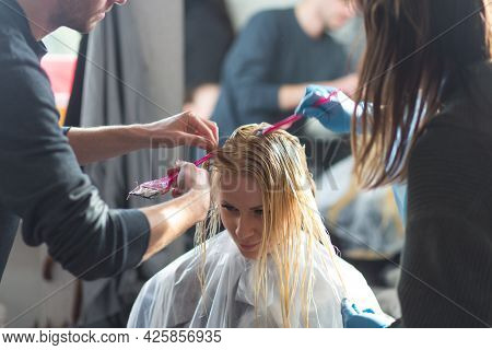 Keune Brand Technologist Artem Raychuk Dyes The Hair Of A Model On Advertising Workshop