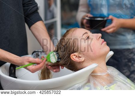 Keune Brand Technologist Artem Raychuk Dyes The Hair Of A Model On Advertising Workshop