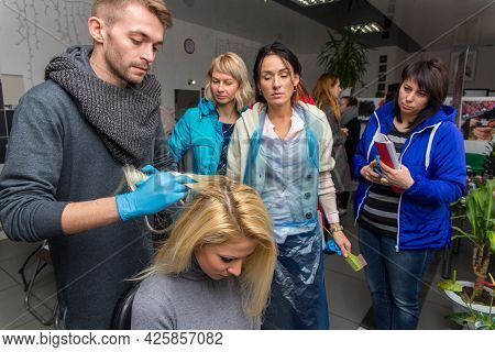 Keune Brand Technologist Artem Raychuk Dyes The Hair Of A Model On Advertising Workshop