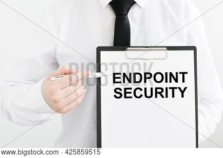 Endpoint Security Inscription On White Paper In The Hands Of A Businessman On A Light Background, On