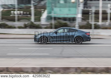 Moscow, Russia - March 2021: Blue Aggressive Bmw Sport Car Riding On The Road With Motion Blur Effec