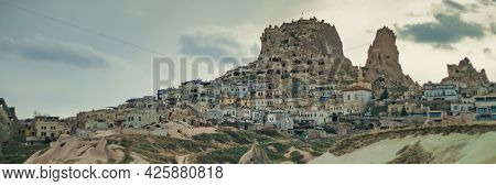 Uchisar Cave Town. Uchisar Castle In Cappadocia Valley In Turkey Goreme. Wide Banner Photo