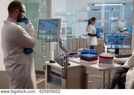Medical Researcher In Scientific Laboratory Analyzing Dna Sample. Chemical Scientis Analyzing Vaccin