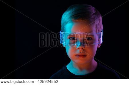 Cute little boy using digital glasses. sci-fi, earth awareness, future mind controlling concept