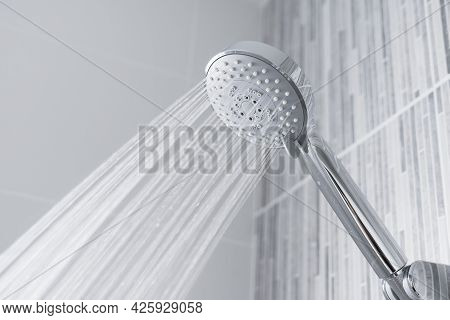 Chrome Shower Head With Splashing Water. Modern Shower Head.