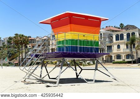LONG BEACH, CALIF - 5 JUL 2021: Pride Tower, at Alamitos Beach. The rainbow-colored lifeguard tower supports the LGBTQ community replacing an earlier tower destroyed in an arson fire. 