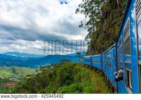 Travel By Public Train Around The Island Of Sri Lanka. The Train Travels Through Mountains And Tea P