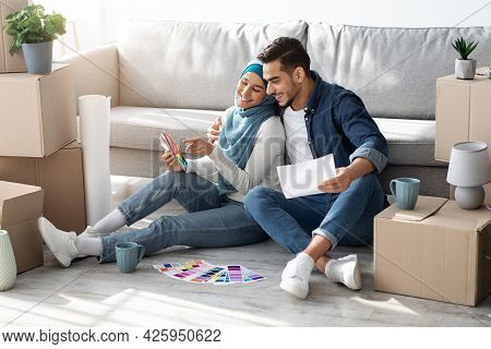 Creative Muslim Family Working On Design For New House