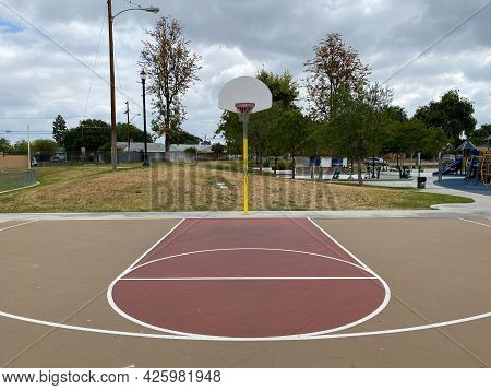 Recreational Facilities With Basketball Court In Residential Community Park In Placentia, California