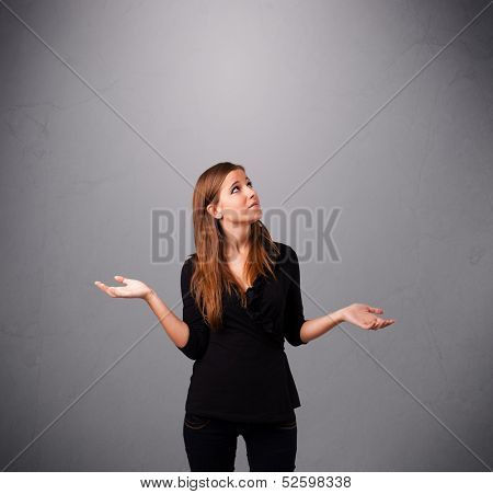 beautiful young lady standing and juggling with copy space